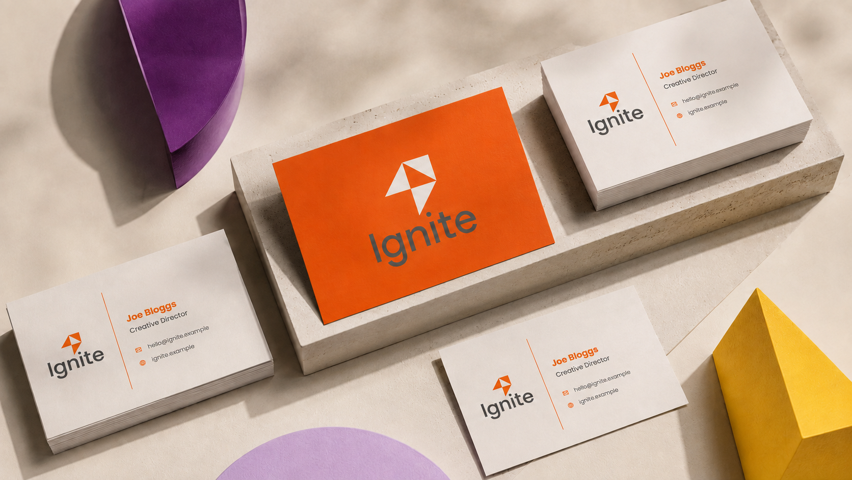 Ignite brand identity applied across business cards and stationery